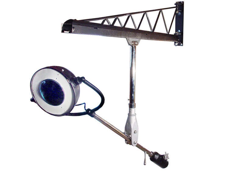 It's an amazing lamp and great fun. The cranes swing arm is 6 foot long and carries a channel track for the lamp. The articulated arm has 4 wheel trolley that easily rolls the full length bringing the lamp 9 foot from the wall. there is also a good