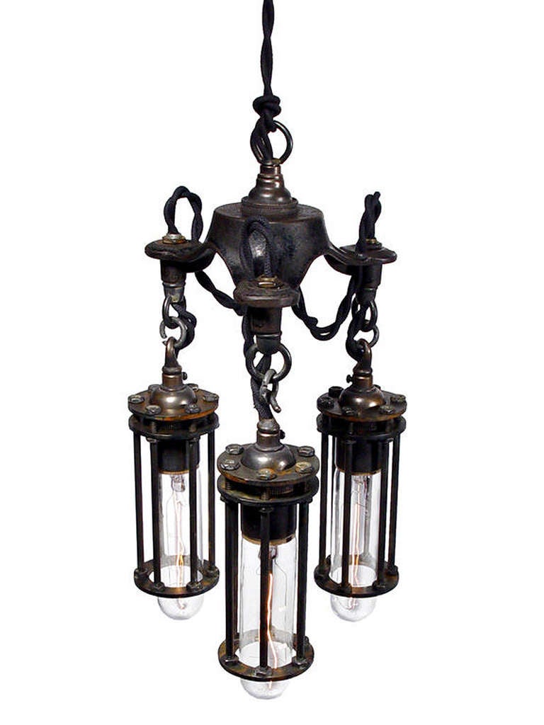 This is a beautiful mini chandelier. The diameter is a compact 7 inches and it’s 12 inches from top ring to bottom. The curve of the cast iron hub and exposed wire loops give this lamp a soft elegant feel. It’s a nice contrast to the simple straight