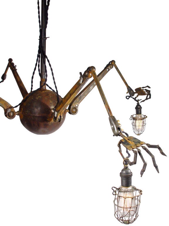 This amazing chandelier will become the focal point of any room it's placed in. It's a bit Steampunk, Adams Family and Nightmare Before Xmas rolled into one. All the joints including 4 on each brass finger are articulated. The lamp at its smallest