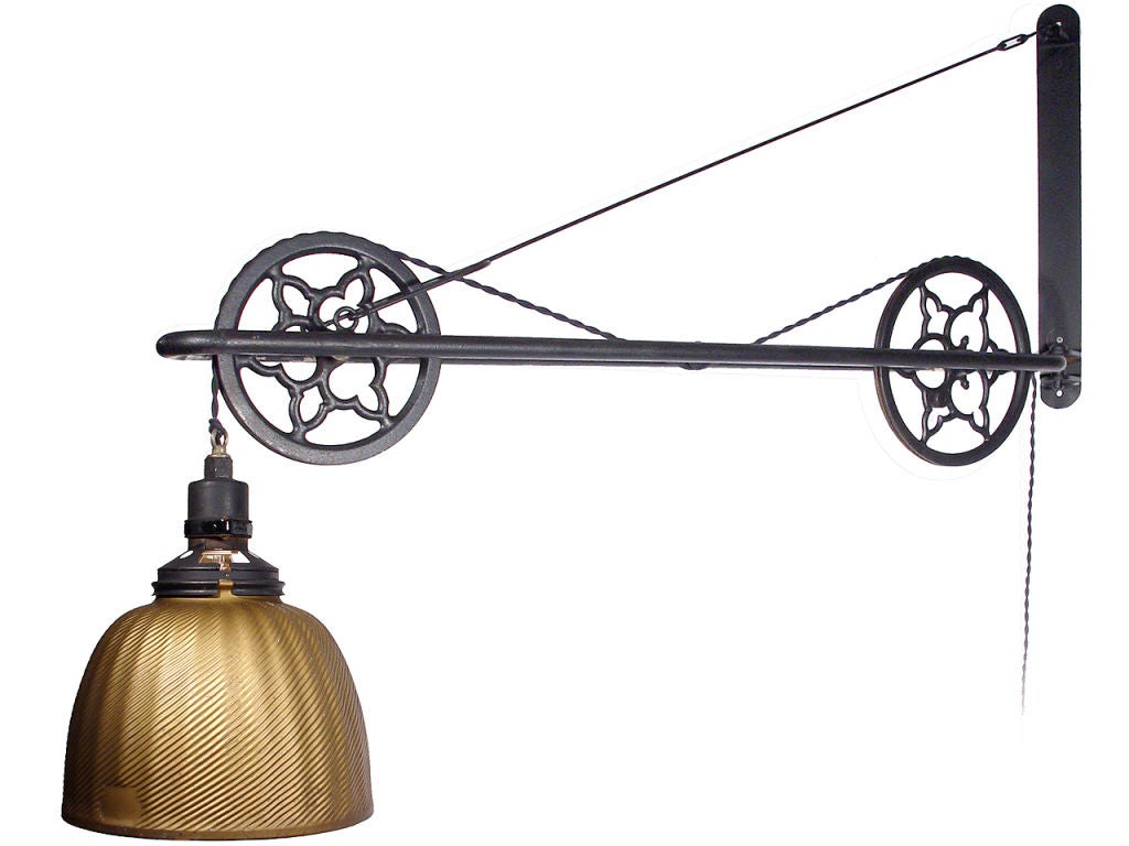 This striking 3 pulley lamp extends from the wall 48