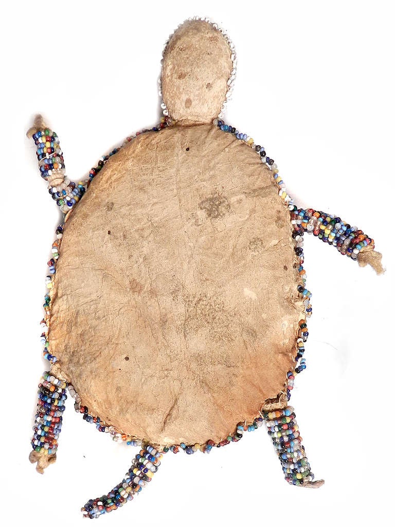 Exceptional old Sioux beaded turtle fetish. Umbilical cords were traditionally placed inside these fetishes, as a measure of good luck and health for the newborn, and hung from the cradle board. Later, they were often worn by the child or attached