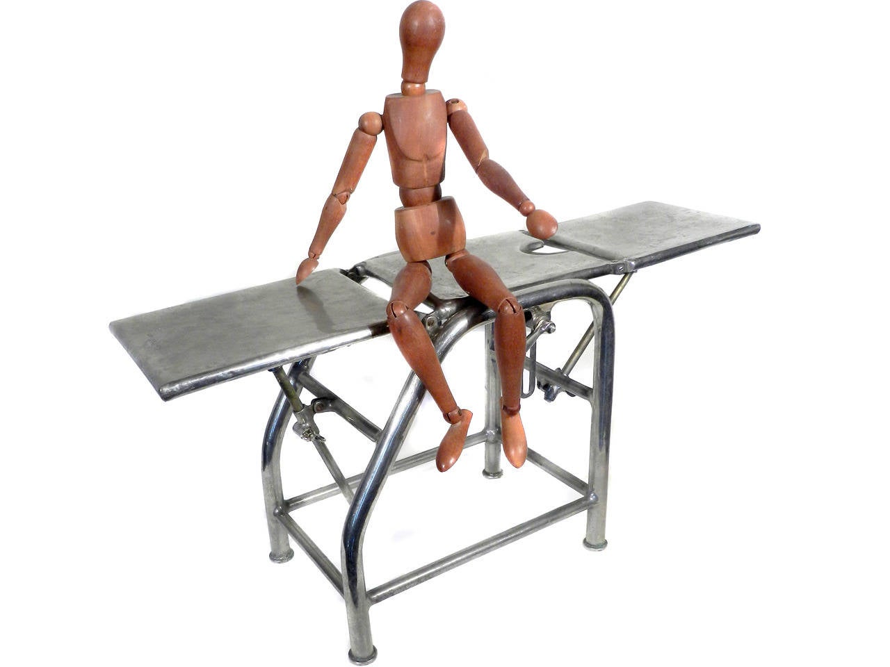 We love salesman's samples. The proportions and details are just are just like the real thing. Just look at the picture. You would think this was a full sized OBGYN exam Apparatus. It's only 24 inches long. This example is also signed… Hebbar,