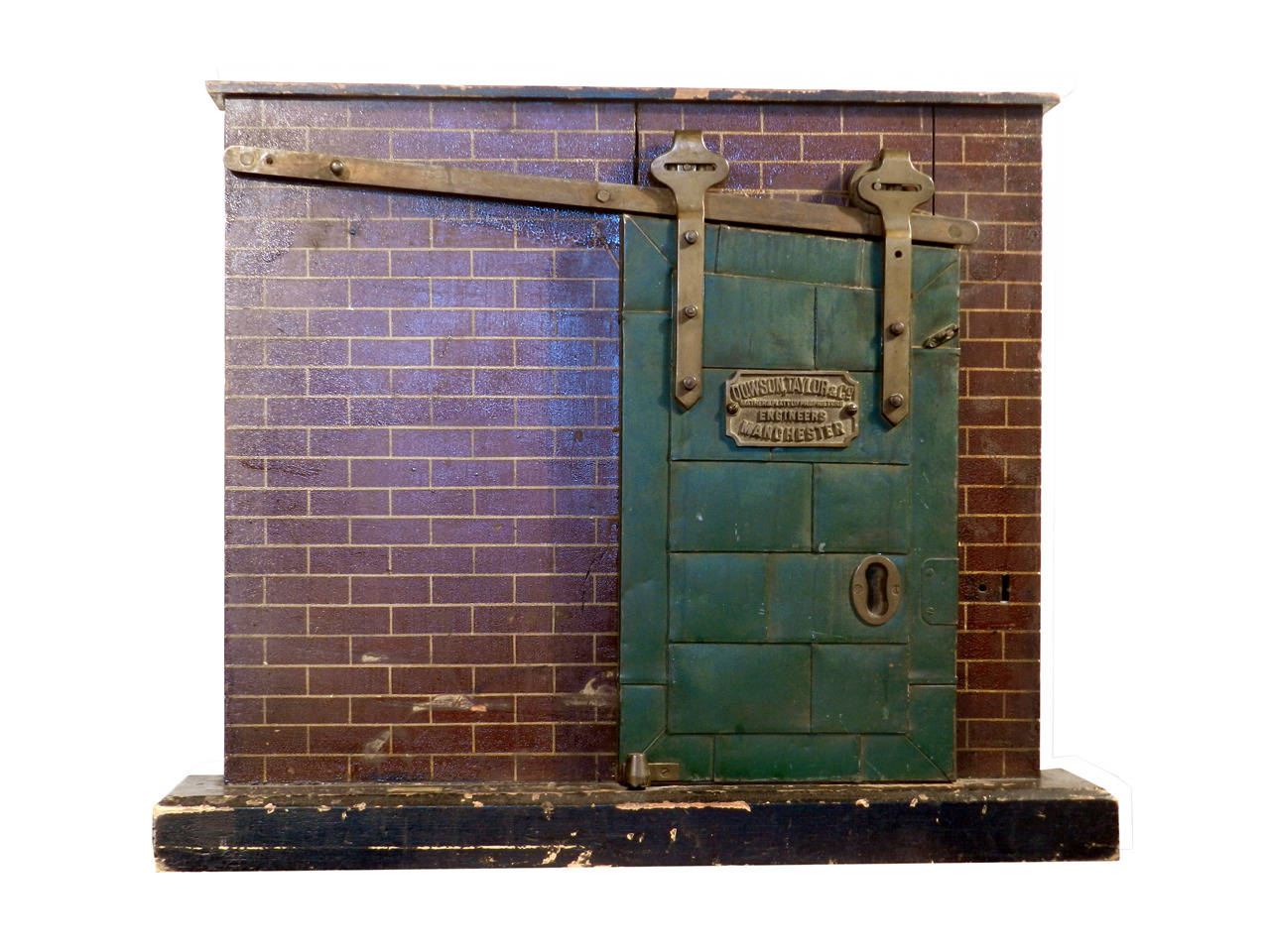 Everyone that walks into the showroom seems to gravitate to this one item. All the detail including it's tin plate construction, hardware, brass plaque and mini brick wall add up to make this display special. It's a lifelike working miniature