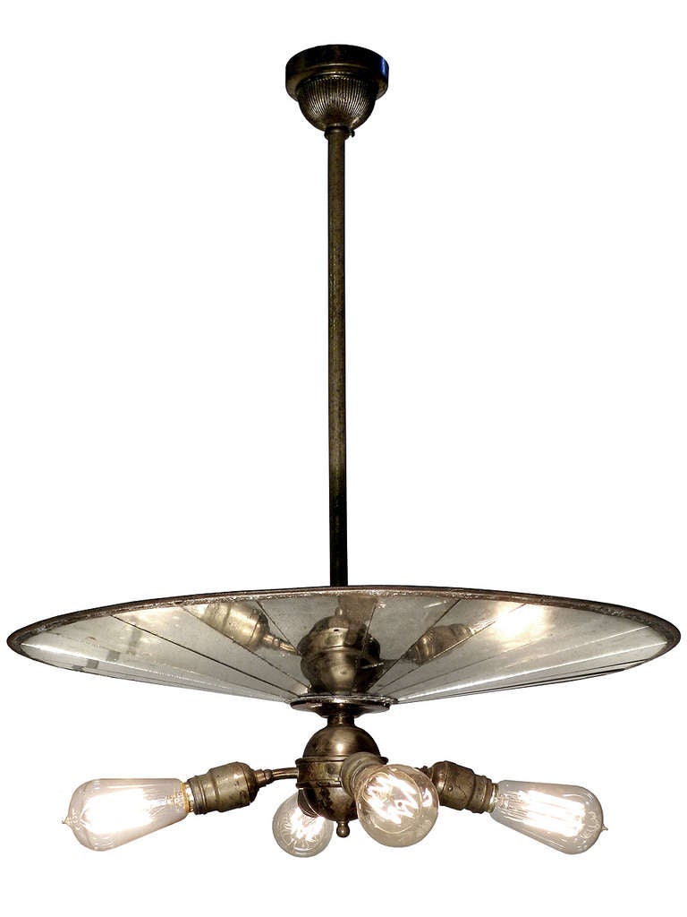 In all the years I've been collecting lighting we have never been able to offer an original like this. These early Wheeler Inverse mirrored shade fixtures are super rare and considered one of the Holy Grail lamps by collectors.. I believe this is