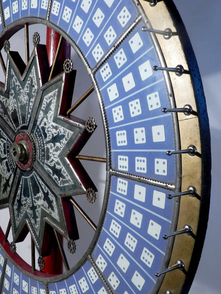 This is the largest Wheel of Fortune H.C. Evans & Co ever made. It was called... The Jumbo Dice Wheel or Big Six Wheel. These decorative wheels were hand made and top of the line. This example has it's original paint and has a nice aged patina.