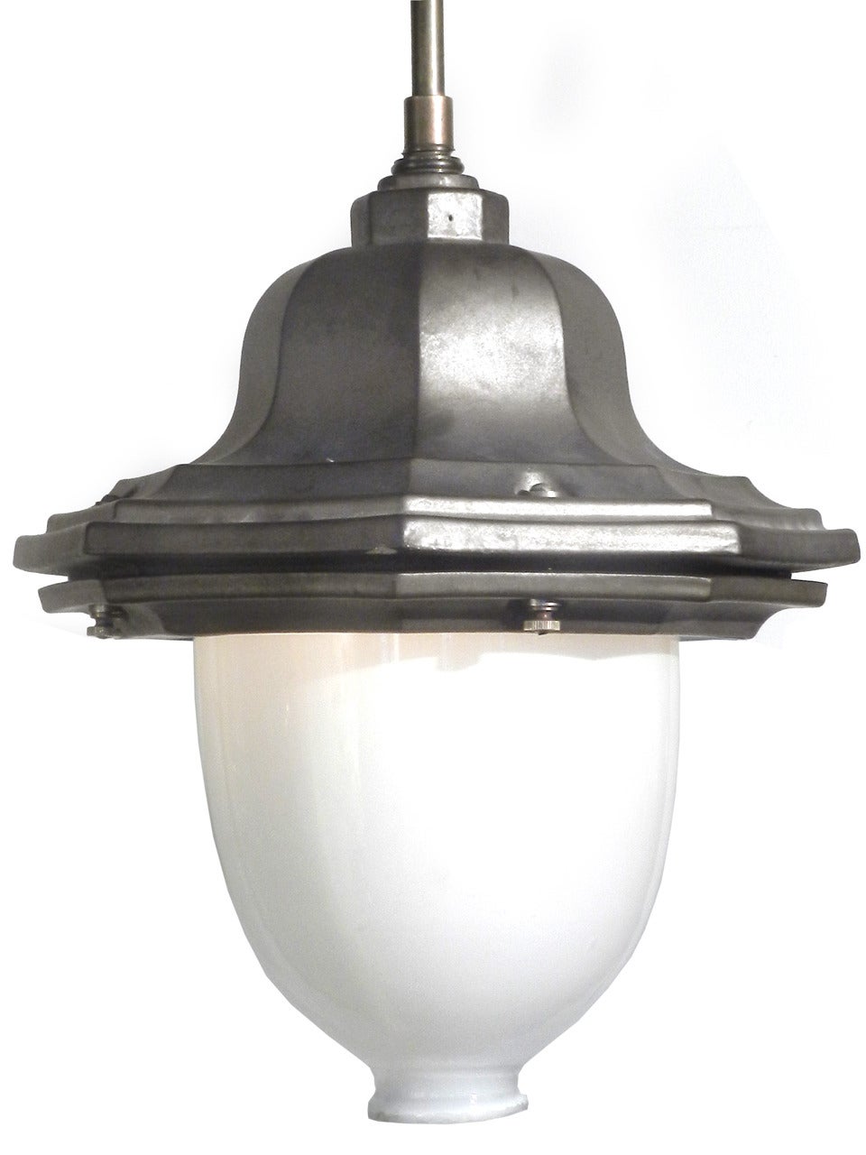 This is a beautifully glazed heavy terracotta lamps was inspired by turn-of-the-century cast iron French street lights. The finish is kiln fired producing a subtle patina in a dark matte gray. It has the feel and finish of Teco pottery. The look and