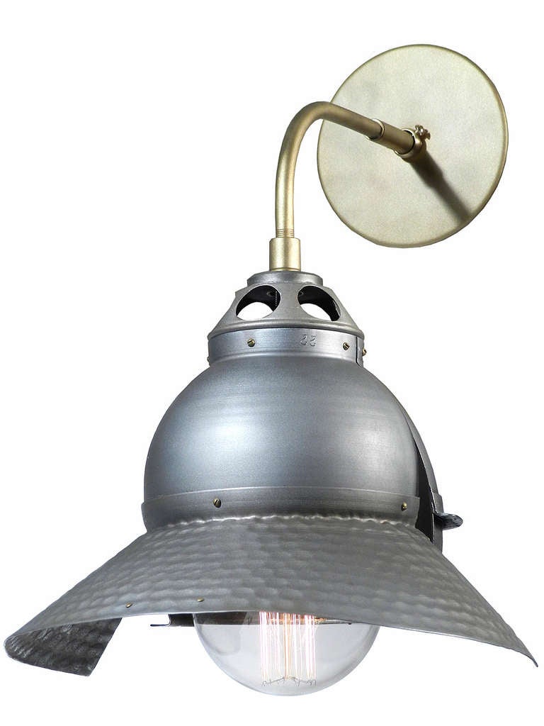 There's just a hint of Darth Vador in each of these lamps. In the 1930s these were directional inside reflectors that were never ment to be seen. Brought out into the open and they have a unique look all their own. The aluminum dome, vented crown