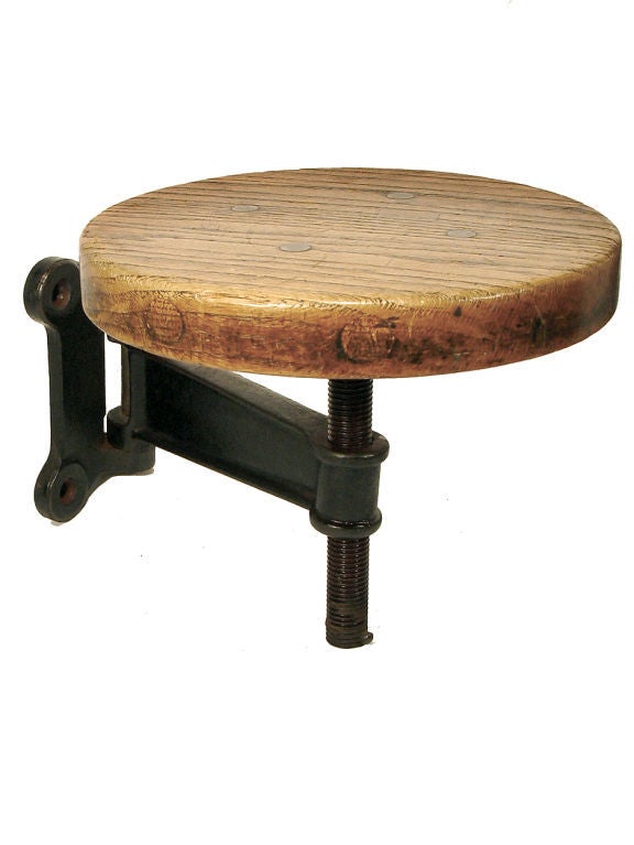 These stools are very well made with a 1.5 inch thick solid oak seat and a 1 inch thick cast iron arm. At the Turn-of-the-Century these benches were found attached to machine and wood working tables. They were very practical for a busy factory