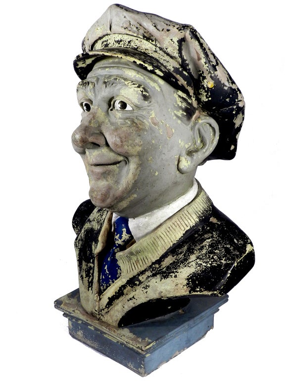 I'm not sure if this life sized bust represents a bus driver or gas station attendant. It's made from an early plastic or composite and has an amazing weathered patina. The face and details have a lot of character. He's very likeable.