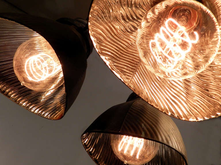 This lamp has just the right look. The three matching 1920s X-Ray shades still have their original gold finish and aged patina. The diameter of this lamp is 12 inches and 12 inches to the loop on top. It's totally unique.
For questions or net