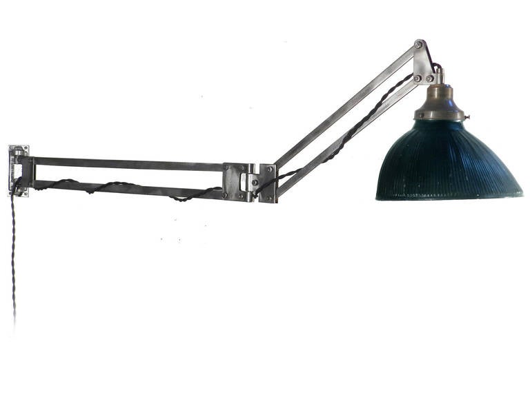 These Burton Light Company lamps are a rare find. They reach out 52 inches and with matching mirrored mercury glass shades shade. The shades are by the X-ray lamp Company. The patented arm is well articulated and easily move in all directions. It's