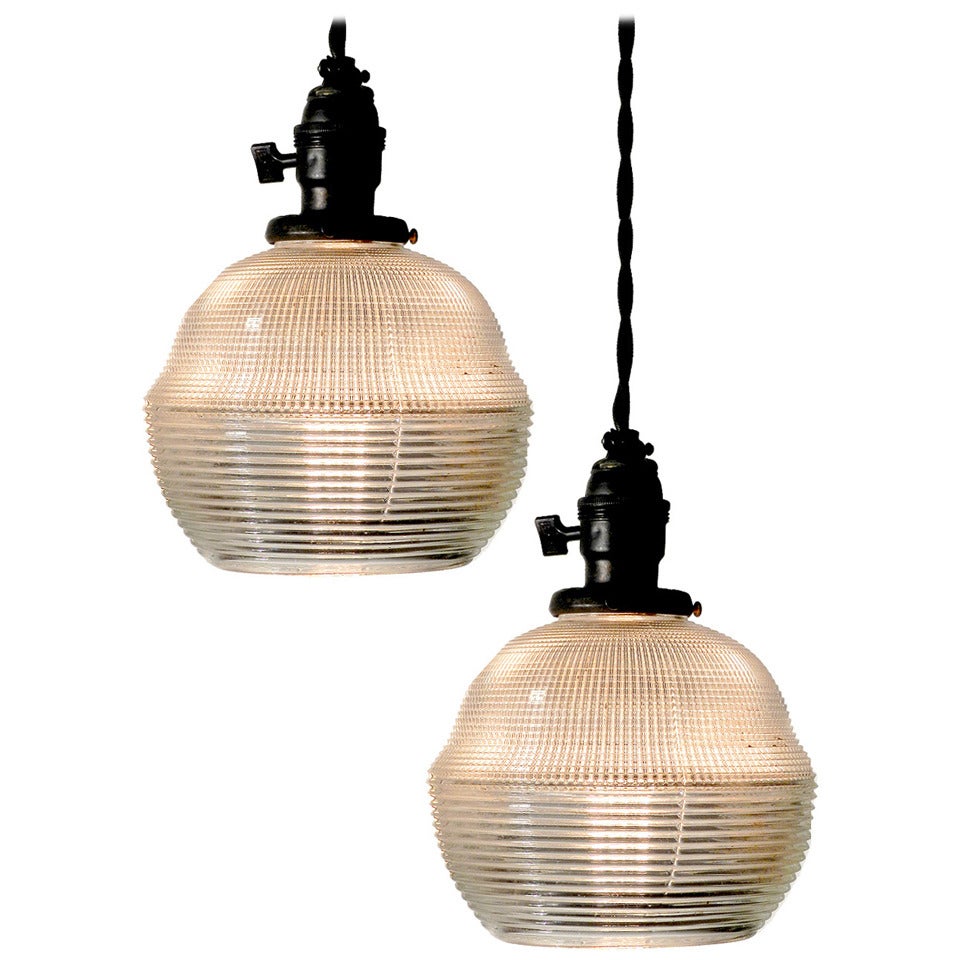 Pair of Unique Holophane Globe Pendents.