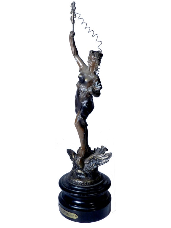 Scarce Original Antique Victorian ‘bronze’ type spelter figurine. Dating from the latter part of the 19th Century or early 20th Century, these Art Nouveau French figurines confidently promote one of the greatest technological inventions by Guglielmo