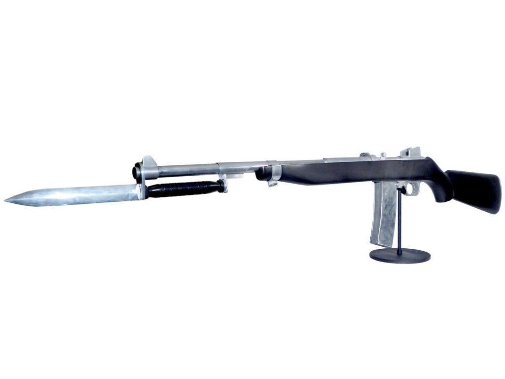 The MI Carbine is one of the hardest to find of all the cut-away training guns. It's almost seven foot long and in wonderful condition. It even has a removable magazine. The WWII display is made of cast aluminum with a ebonised wood stock showing