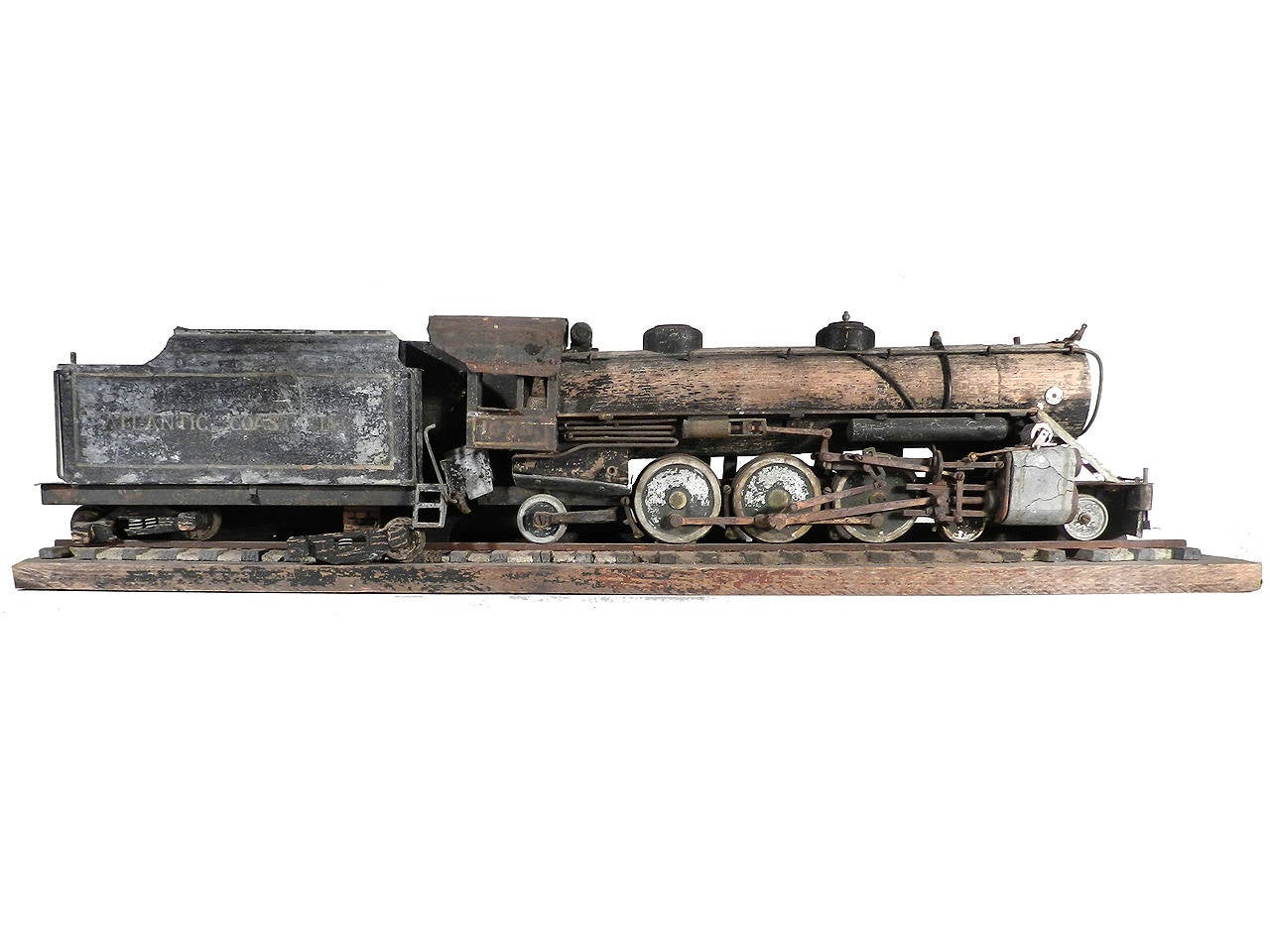 If you like Atlantic Coast Line Railroad Memorabilia - 4-6-2 Steam Locomotives Automaton Folk Art, one of a kind decorator pieces this is it. It was built in the 1950s, and also includes a photo of this wonderful piece when it was newly completed,
