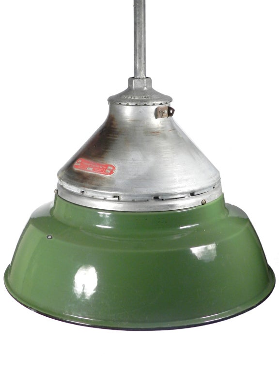 If you like your industrial lamps robust you'll find them here. Here is a classic pair of Appleton. They are the companies largest 22 inch examples. All have green over white porcelain shades as well as a heavy cast upper aluminum lamp housing. The