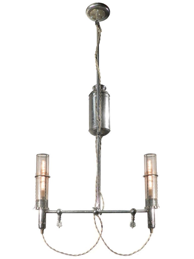 This is a large and dramatic nickel plated lamp. It's very unusual and not the type of lamp you will find electrified. The hight is adjustable and will slide from 42 inches to 60 inches tall. It's only 8 inches deep but has a 21 inch spread. The 2
