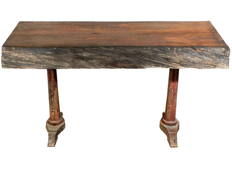 The table top is a solid 5.5 inch thick oak with natural bark edges. A tiger oak grain is running through it. Most interesting is the rustic top and formal column legs.
Check the close ups on the cast iron legs. The color and paint patina just