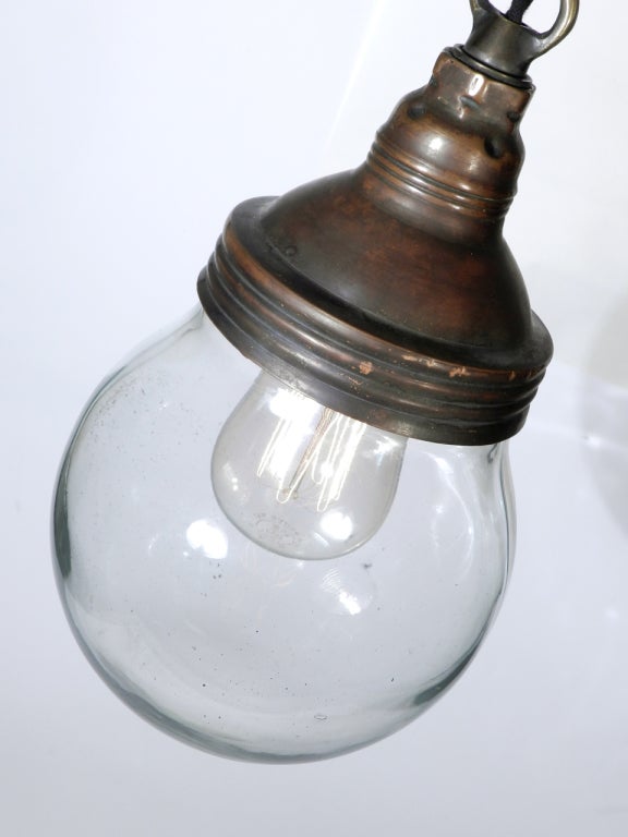 This Benjamin pendent light is sought after among those that collect and trade industrial lighting. It's elegant simplicity and quality explosion proof construction have just the right look. There are a few versions of this lamp but the examples