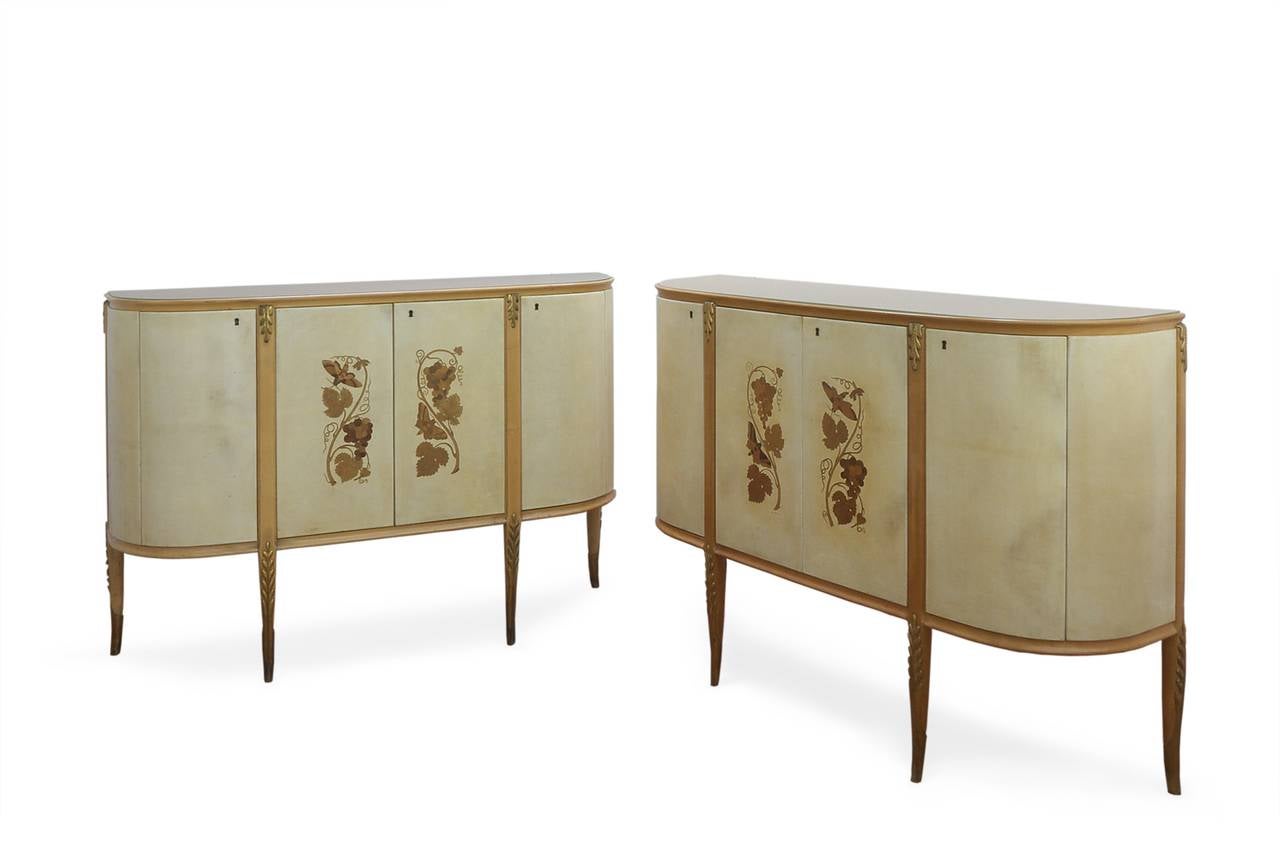 Pair of Credenzas by Giovanni Gariboldi, Circa 1946-48, possibly custom made by Colli, Turin.

Two matching credenzas,in carved pearwood and gilding, with fitted glass top in golden Opaline, having four parchment covered doors. Each cabinet with
