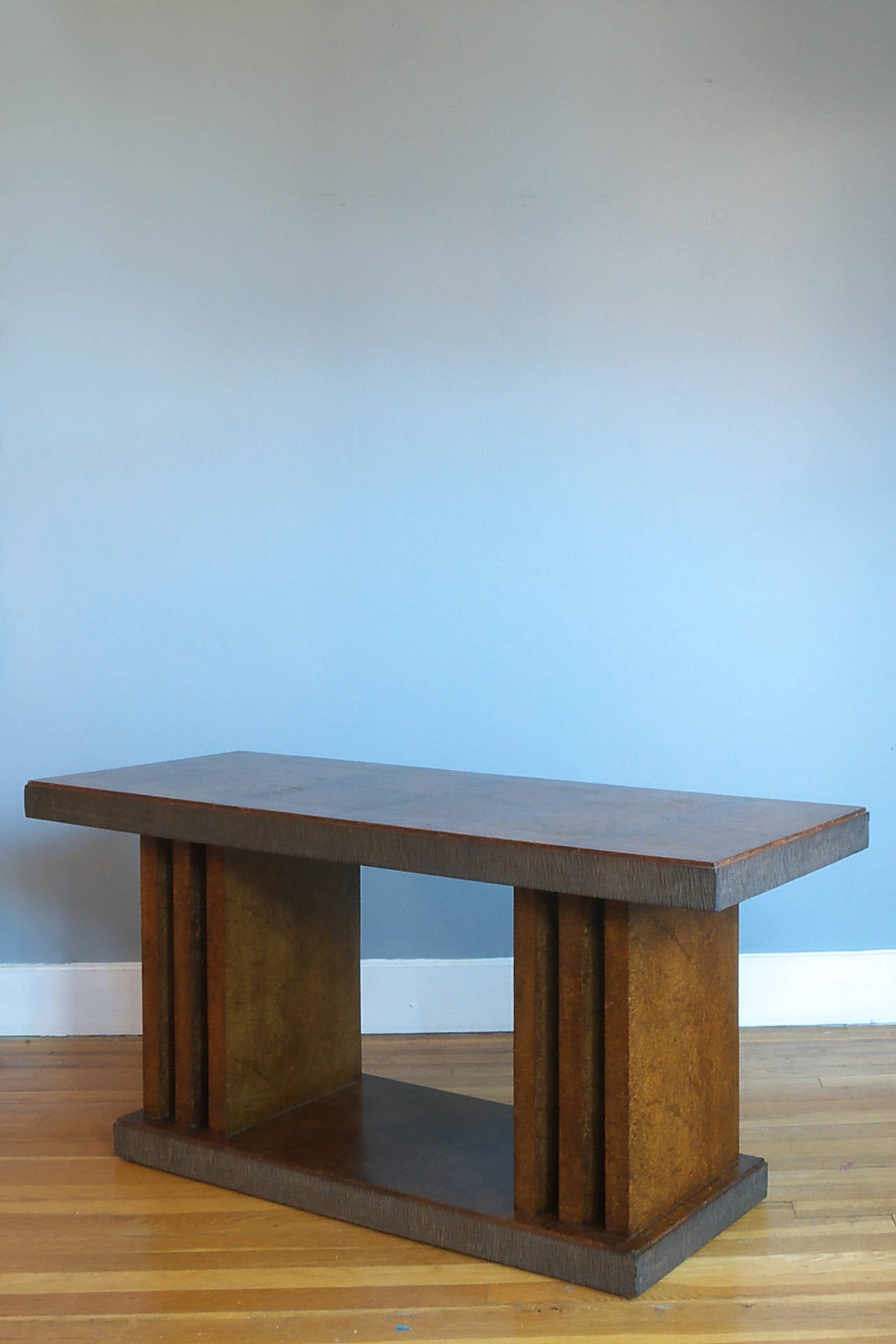 A low freestanding console table and bench by Pier Luigi Colli. Of amboyna veneer and carved walnut.