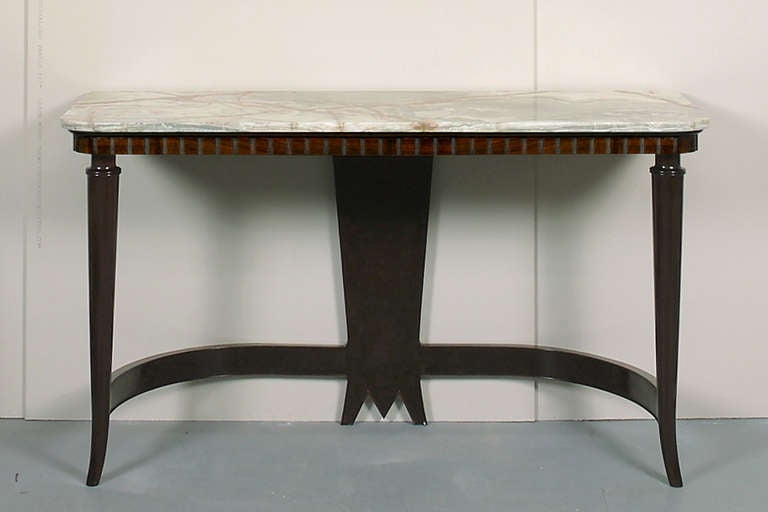 A walnut and onyx console table by Luigi Scremin. Combining elements of neoclassical and medieval design.