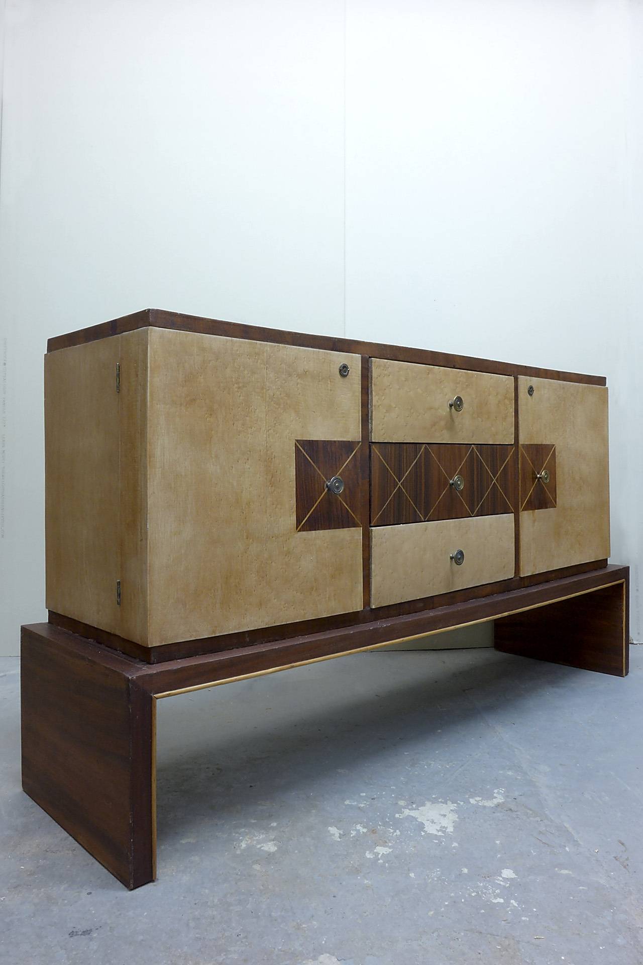 Asian inspired sideboard in the style of Osvaldo Borsani and Guglielmo Ulrich. Three drawers and two doors.