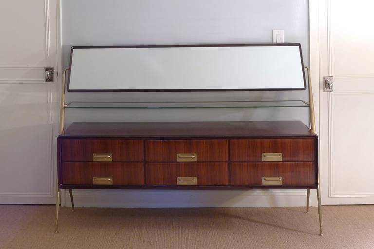 A brass mounted chest of drawers with adjustable mirror and glass shelf.

Literature: I. De Guttry, M. P. Maino, Il mobile italiano degli anni '40 e '50, Laterza, 1992, p. 136