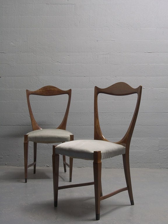 A rare and important pair of side chairs by Paolo Buffa produced by Arrighi of Cantu. Carved mahogany with ebony inlays. A superb example of Milanese design executed with exceptional craftsmanship.