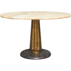 A Milanese onyx and giltwood low table