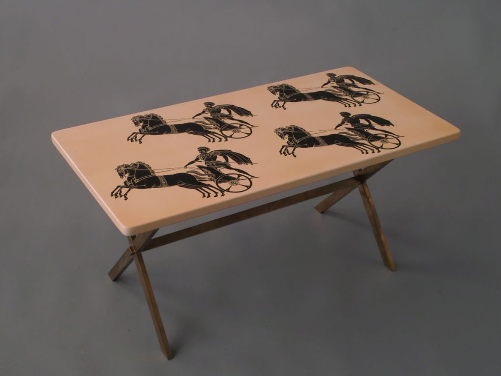 Rectangular painted top resting on a classic shaped brass stand. With the original manufacturers label.