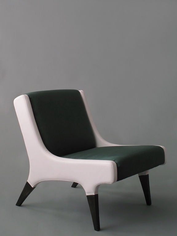 A pair of lounge chairs with ottomans by Gio Ponti 2