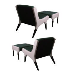 A pair of lounge chairs with ottomans by Gio Ponti