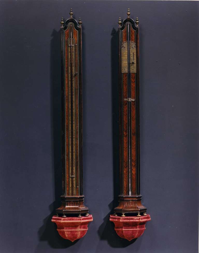 Each of elongated arched form with protruding flared bases raised on brass bun feet. The thermometer with brass engraved temperature scale, stamped on the base 3756. The barometer with shaped and engraved vernier scale inscribed C Leret / A Roüen,