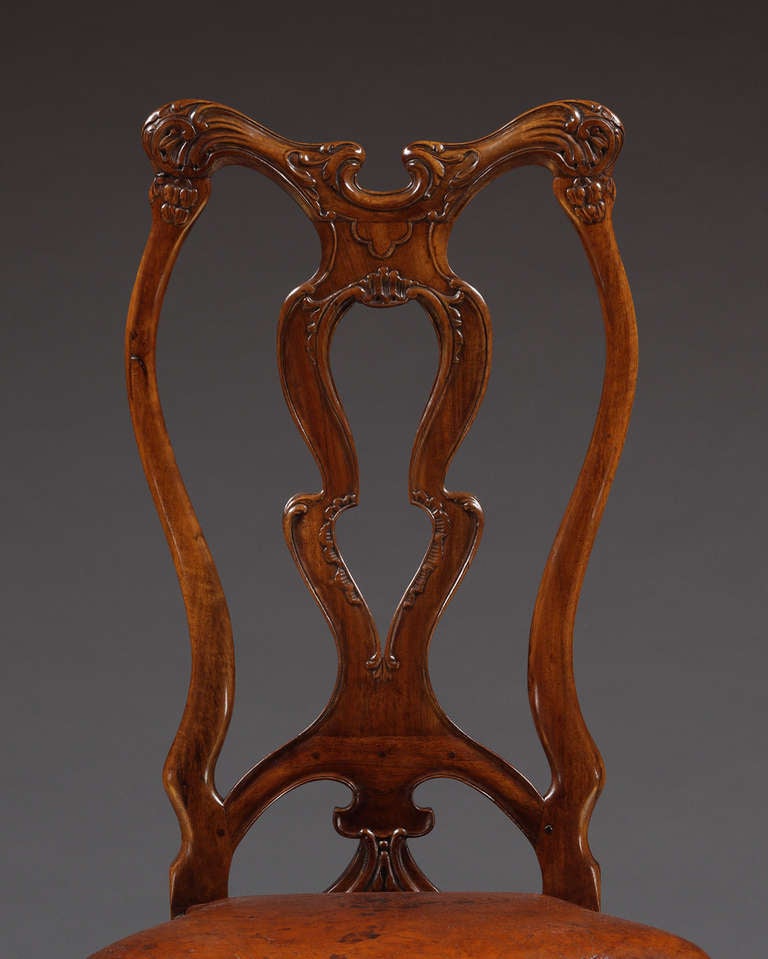 Spanish A Set Of Twelve Carved Walnut Dining Chairs Of Unusual Form For Sale
