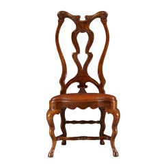 A Set Of Twelve Carved Walnut Dining Chairs Of Unusual Form