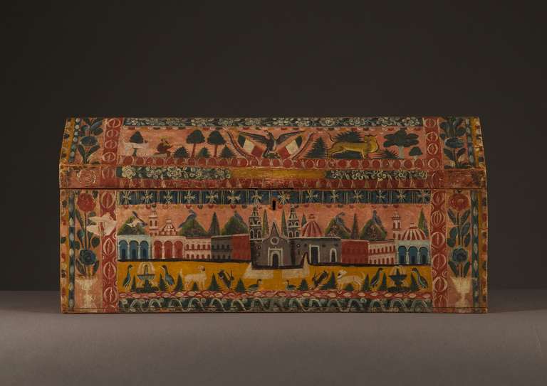 Of rectangular form with domed lid, decorated on four sides with painted lacquer depicting flowers, animals, and borders of cowrie shells. The front depicting a cityscape with cathedral in the center and mountains in the background, the sides