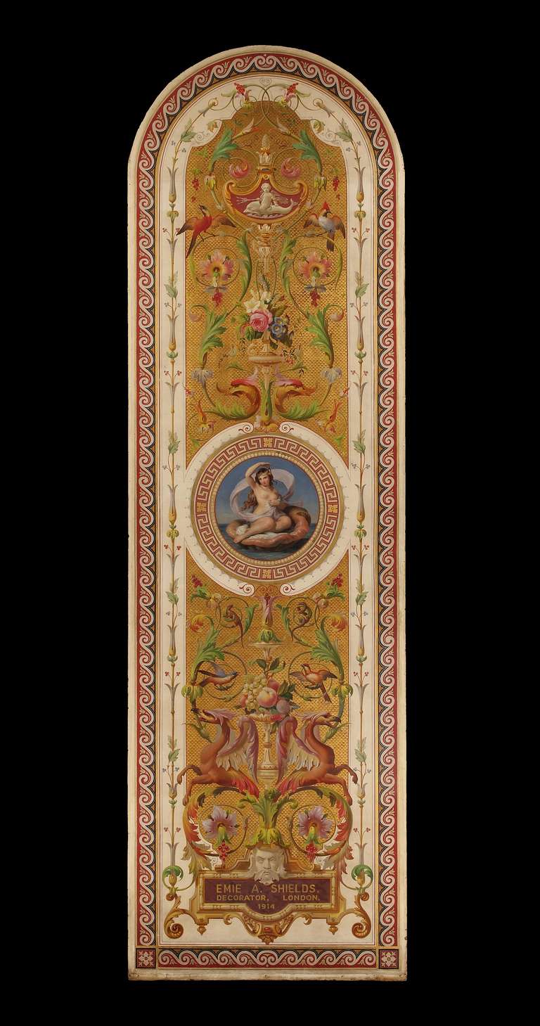 The unframed panel of arched form is centered by a painted Greek key framed roundel of Venus seated in a shell. The gilded ground is overpainted with burnt umber triangles upon which is painted a system of ornament including griffons, birds, putti,