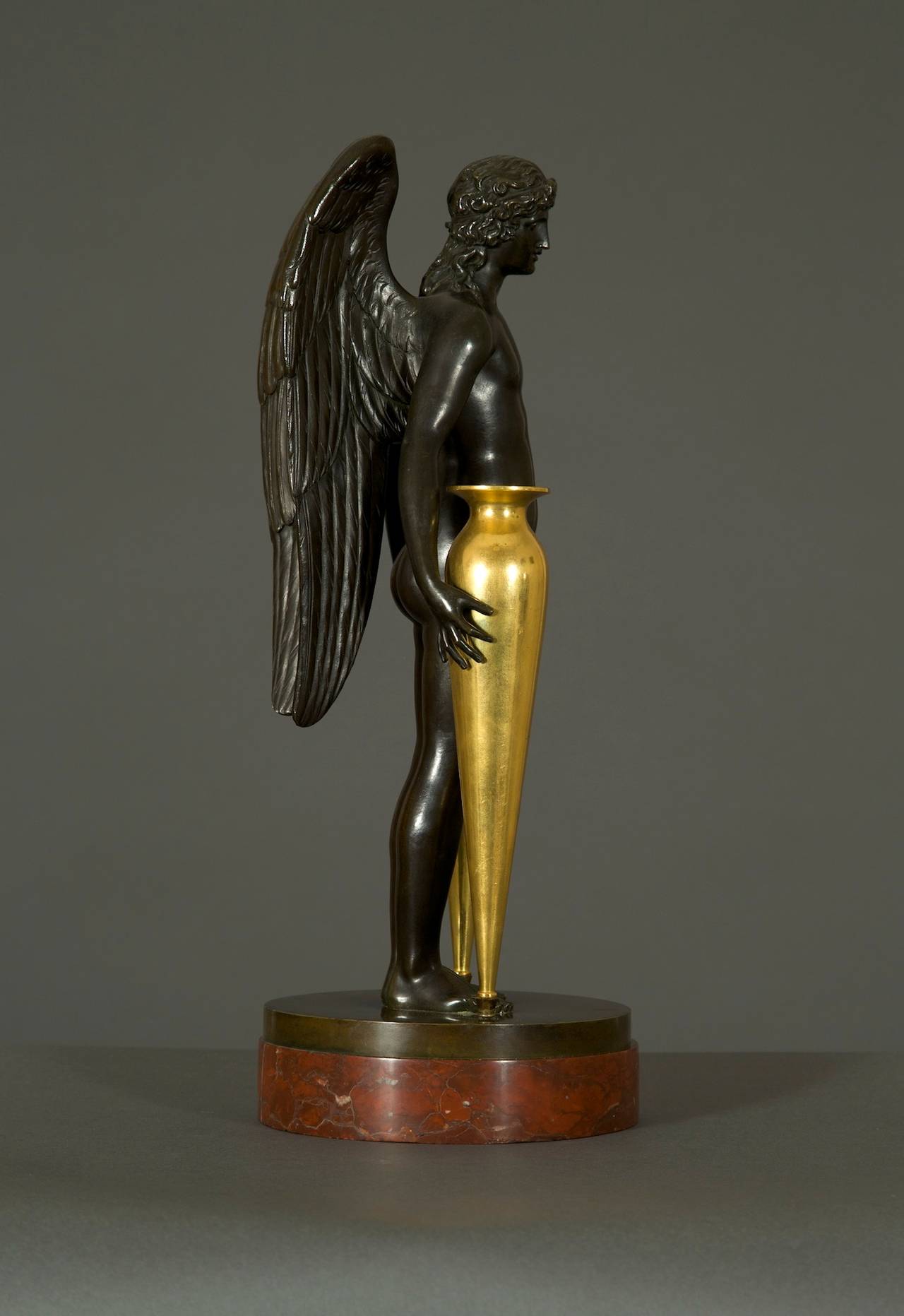 French Fine and Unusual Patinated and Gilt Bronze Centerpiece in the Form of Cupid For Sale