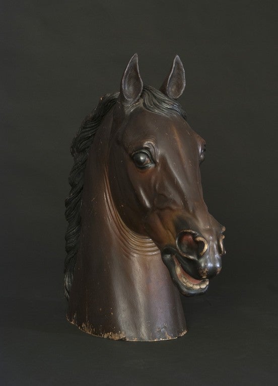 Sculpted model of a horse's head retaining its original decoration.
