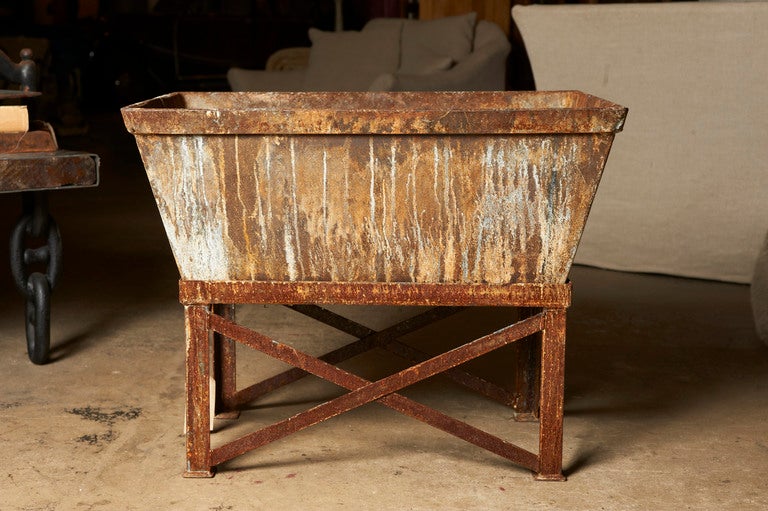 Industrial iron factory bin on stand, c. 1940-50, now a jardiniere, 2 available, sold separately