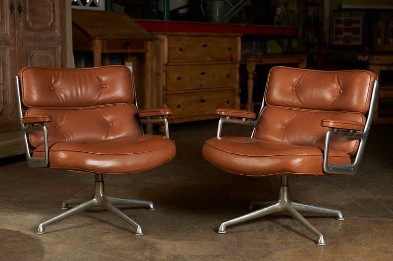  Herman Miller swivel chair, c. 1960, covered in leather on aluminum bases, purportedly from the Time-Warner Building. One available.