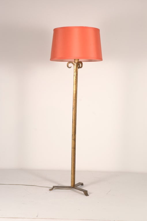 Tall forged,with gold patinated metal floor lamp designed by Rose Tarlow