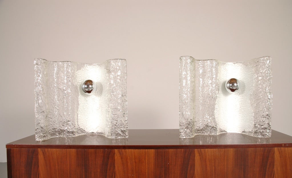 Unusual pair of  textured clear and white glass table lamps. Polished metal socket.