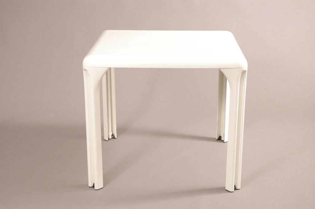 Crisp white italian fiber glass table, with black feet. Chair by G.Bear (not included )