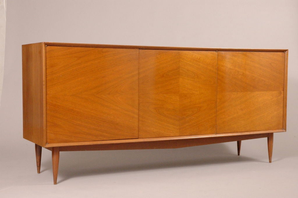 Magnificent Italian Walnut Credenza,with book matched veneer doors,revealing shelfs and drawers.