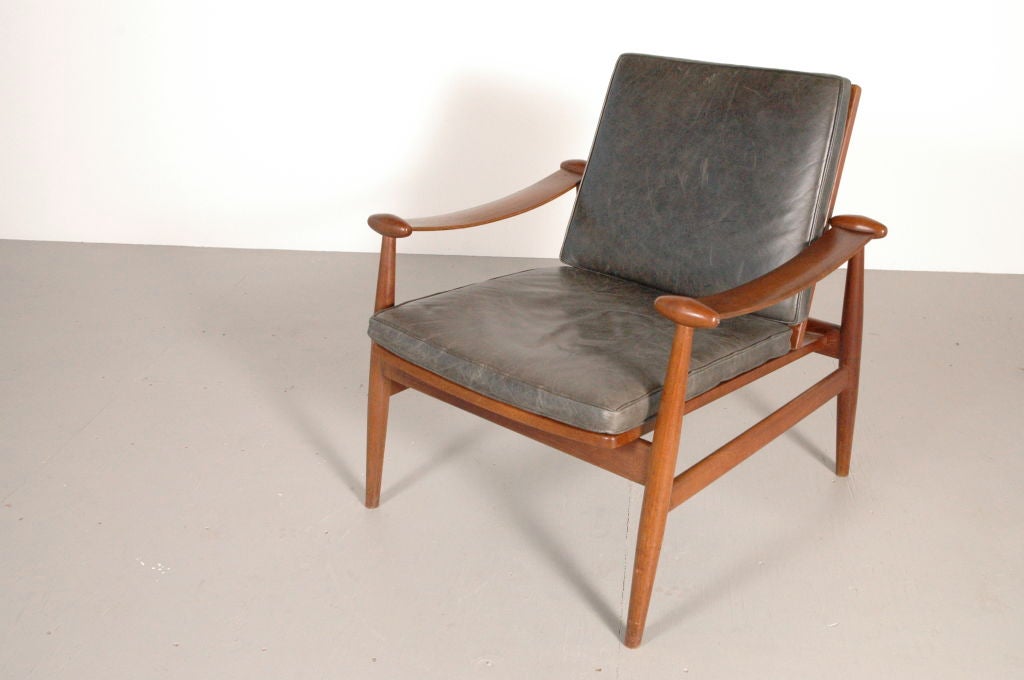 Teak and leather lounge chair, by Finn Juhl for France and Sons