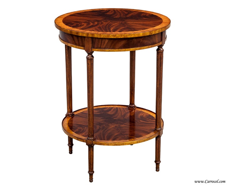 This is a pair of beautiful end tables.  Made with exotic satinwood banding and book-matched flamed mahogany, they are brand new and very well made.  Constructed from mahogany solids and hand-selected flamed mahogany veneers, they are high quality