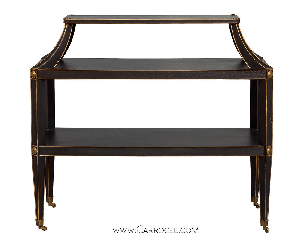Michael S Smith designed Volitaire Server from Baker Furniture. Brown crackle finish with painted gold accents and brass medallions. Inspired by 1940’s French salon étagères.