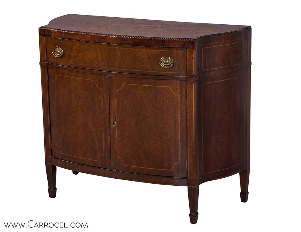 Classic American made Mahogany in its original glowing patina with pin inlay Hepplewhite chest, server, credenza, console. Gently serpentine gables and bowed front with beaded trim on top edge and fine inlay, mullions and trim adorn this timeless
